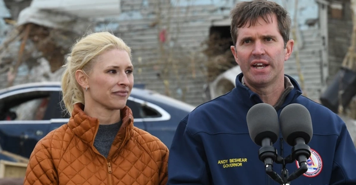 Dawson Springs, KY, USA--December 15, 2021--Governor Beshear and wife Britainy Beshear speak at a press conference with President Joe Biden in a neighborhood impacted by the recent tornadoes which occurred on December 10, 2021.