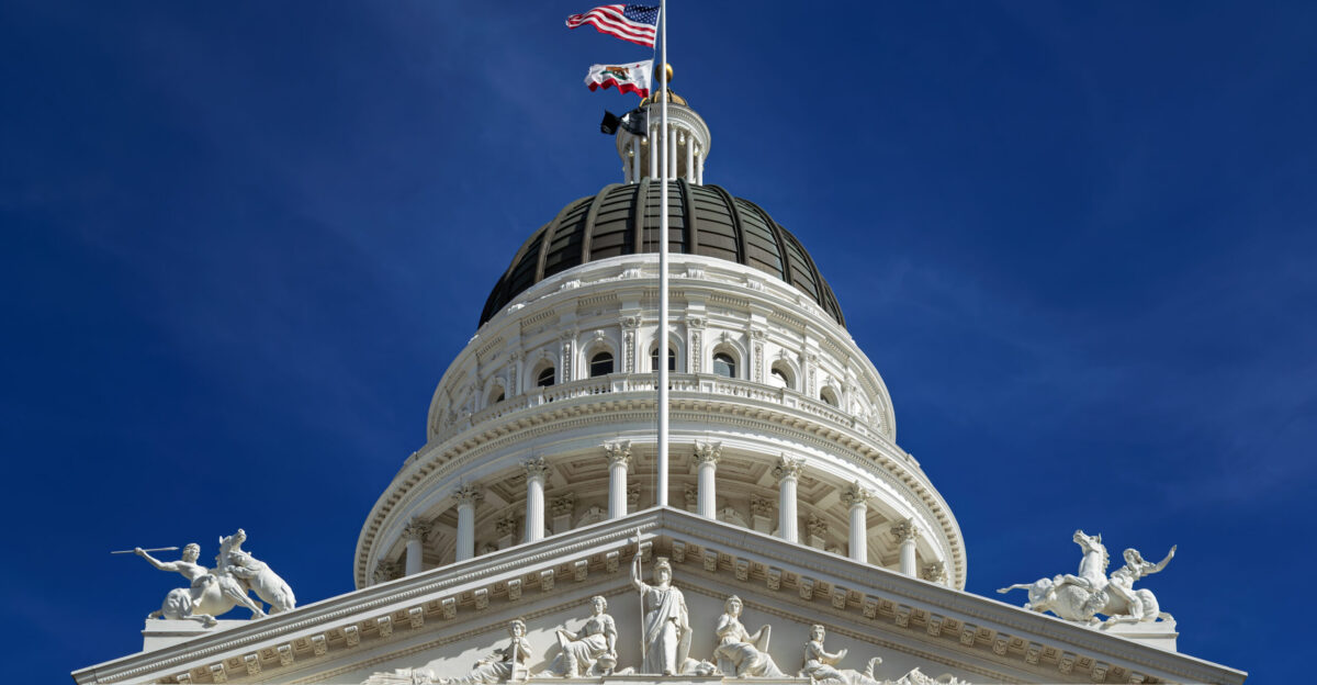 Northwest view up to the pediment rotunda and dome of the California State Capitol in Sacramento