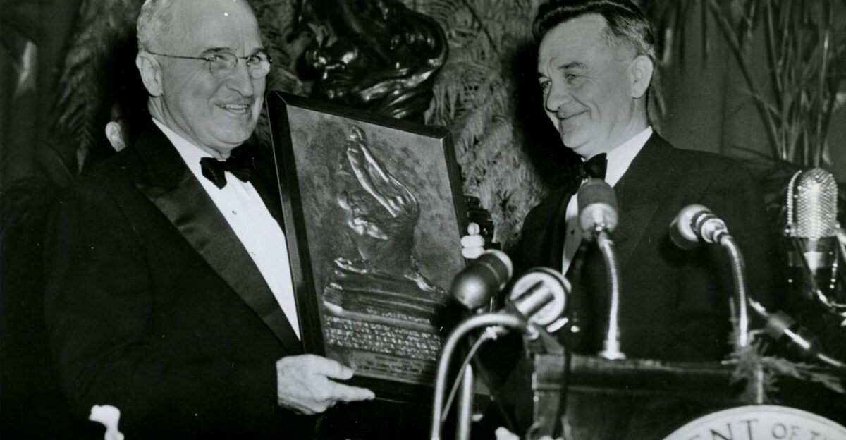President Harry S Truman left presenting the 1951 Collier Robert J Trophy to John Stack