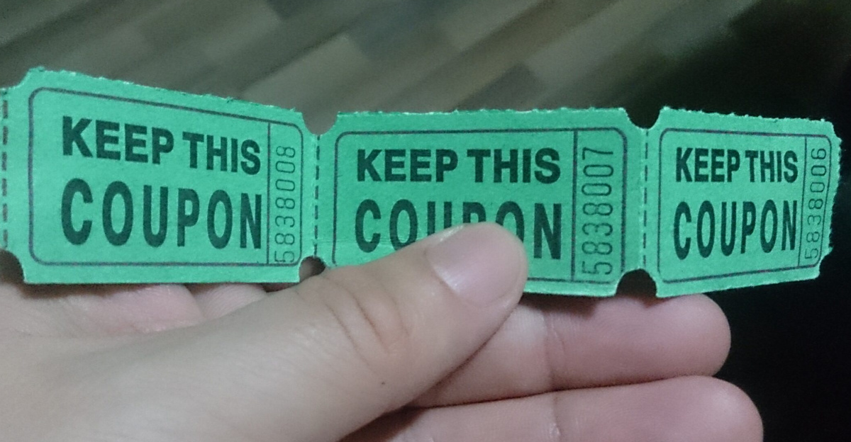 A person holding coupons
