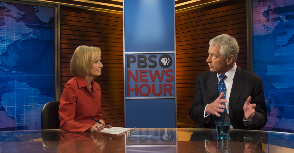 Secretary of Defense Chuck Hagel joins Judy Woodruff on the set of the PBS NewsHour in Arlington, Va., Sept. 18, 2013, to discuss reviews he ordered in the wake of the Washington Navy Yard shootings two days earlier as well as security issues in the Middle East. (DoD photo by Sgt. Aaron Hostutler, U.S. Marine Corps/Released)