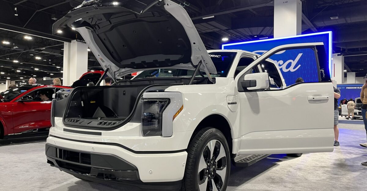 Front left quarter view of a 2023 Ford F-150 Lightning at the 2023 Denver Auto Show