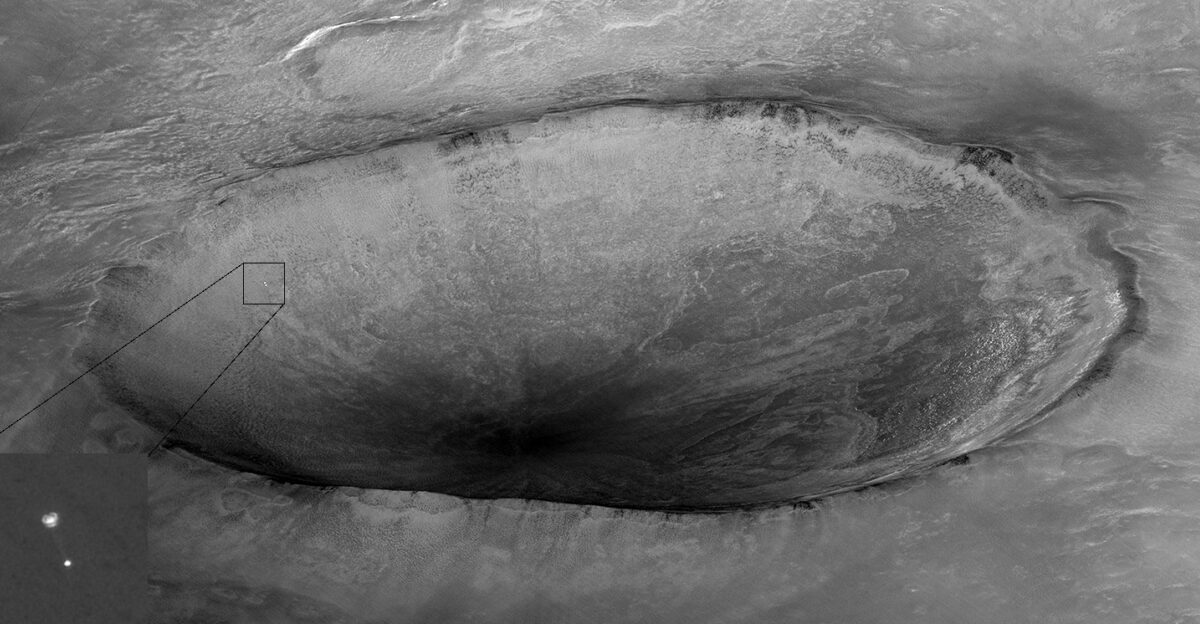 Image taken by Mars Reconnaissance Orbiter showing descent of Phoenix with a crater in the background Original caption from NASA Mars Reconnaissance Orbiter s High Resolution Imaging Science Experiment HiRISE camera acquired this image of Phoenix hanging from its parachute as it descended to the Martian surface Shown here is a 10 kilometer 6 mile diameter crater informally called Heimdall and an improved full-resolution image of the parachute and lander Although it appears that Phoenix is descending into the crater it is actually about 20 kilometers about 12 miles in front of the crater Given the position and pointing angle of MRO Phoenix is at about 13 km above the surface just a few seconds after the parachute opened This image shows some details of the parachute including the gap between upper and lower sections At the time of this observation MRO had an orbital altitude of 310 km traveling at a ground velocity of 3 4 kilometers second and a distance of 760 km to the Phoenix lander The Phoenix Mission is led by the University of Arizona Tucson on behalf of NASA Project management of the mission is by NASA s Jet Propulsion Laboratory Pasadena Calif Spacecraft development is by Lockheed Martin Space Systems Denver