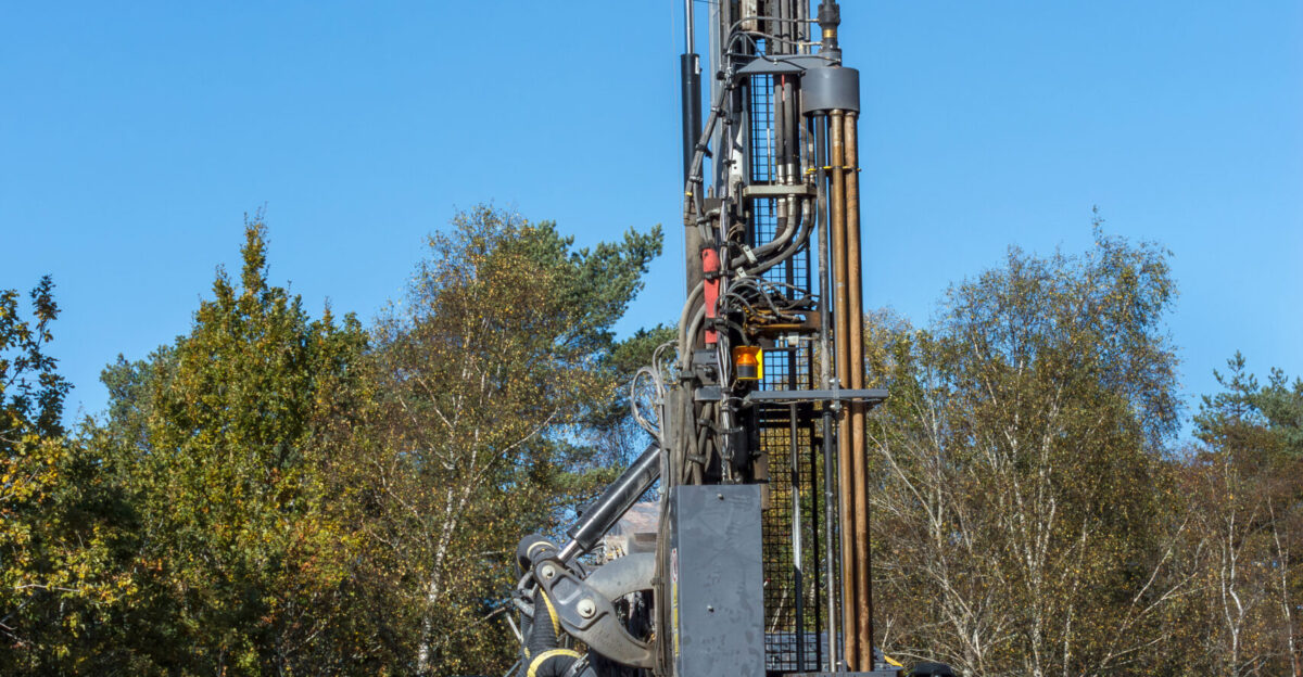 Epiroc SmartRoc T40 surface drill rig from Vestfold Fjellboring AS drilling blast holes for dynamite into granite rocks at a construction site for a new house in Tuntorp Brastad Lysekil Municipality Sweden The image is focus stacked from two photos