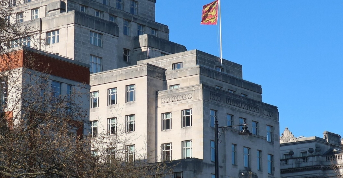 The Duchy of Lancaster offices, at 1 Lancaster Place, Strand, London WC2, viewed from the Victoria Embankment. It flies the Duchy flag. The taller building to the left is Brettenham House, a commercial office building also owned by the Duchy (and constructed at the same time).