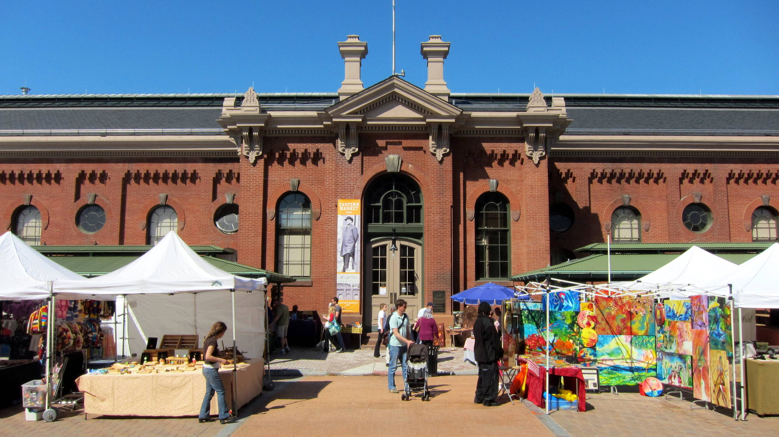Eastern Market located at the intersection of 7th and C Streets S E in the Capitol Hill neighborhood of Washington D C Built 1871-1873 to the designs of noted architect Adolf Cluss Eastern Market is an example of Italianate architecture The building was listed on the National Register of Historic Places NRHP in 1971 and is designated as a contributing property to the Capitol Hill Historic District listed on the NRHP in 1976