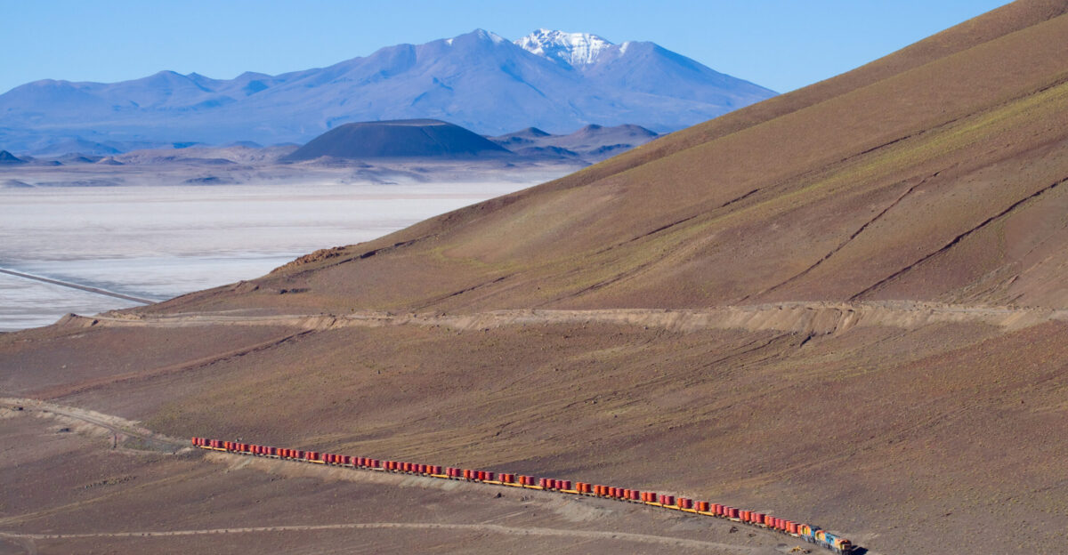 FCAB GL26C-2 2005 2010 and GT22CU-3 2402 climb the pass between Salar de Carcote and Salar de Ascotan The train hauls lead ore from the San Cristobal mine in Bolivia to Antofagasta in Chile