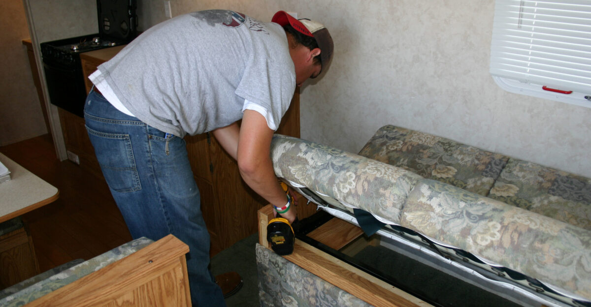 Atlanta Georgia July 5 2005 - A contractor repairs the sofa during the refurbishing of this FEMA travel trailer at the Atlanta Territorial Logistics Center TLC The TLC is preparing FEMA resources for the upcoming hurricane season FEMA Photo Mark Wolfe