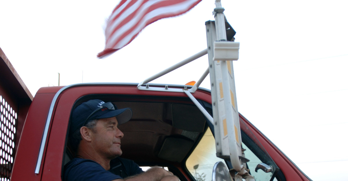New Orleans LA September 10 2005 - Members of the FEMA Urban Search and Rescue team wait for their vehicles to be decontaminated at base camp after being in areas impacted by Hurricane Katrina