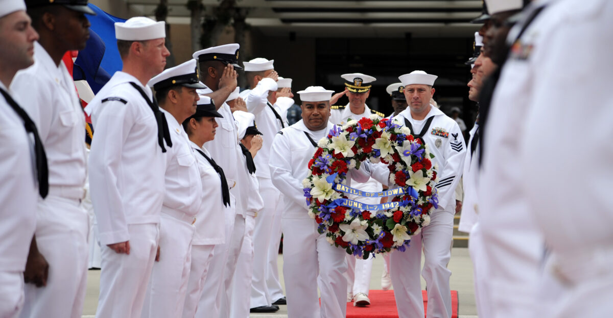 MARINE CORPS BASE CAMP PENDLETON Calif June 4 2012 Petty Officers 1st Class Gomecindo Rodriguez left and Luke Rohrer carry a wreath to be placed at the Naval Hospital Camp Pendleton flag pole while taps is played during the hospital s commemoration of the 70th anniversary of the Battle of Midway U S Navy photo by Mass Communication Specialist 1st Class Michael R McCormick Released 120604-N-HJ915-153 Join the conversation navylive dodlive mil