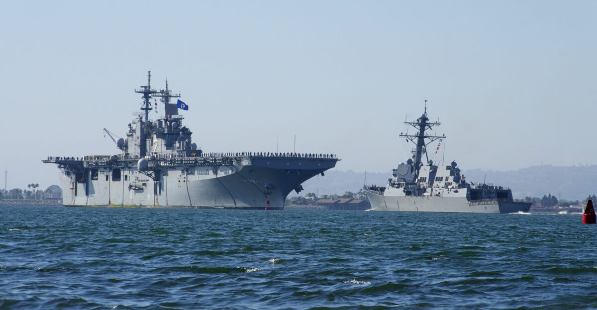 SAN DIEGO Aug 14 2012 The amphibious assault ship USS Essex LHD 2 passes the Arleigh Burke-class guided-missile destroyer USS Stockdale DDG 106 in San Diego Bay as Essex returns home after participating in Rim of the Pacific RIMPAC exercise U S Navy photo by Senior Chief Mass Communication Specialist Joe Kane Released 120814-N-ZC343-381 Join the conversation navylive dodlive mil