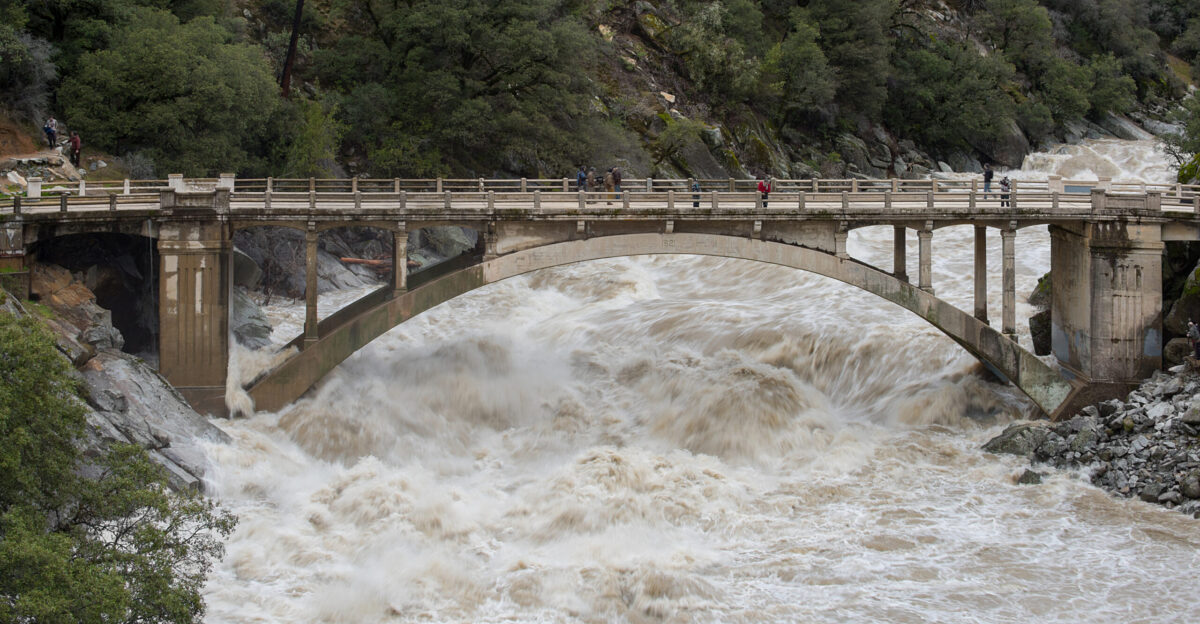 Flood under the Old Route 49 bridge crossing over the South Yuba River in Nevada City California saw local and regional visitors during the atmospheric river event across Northern California on January 9 2017