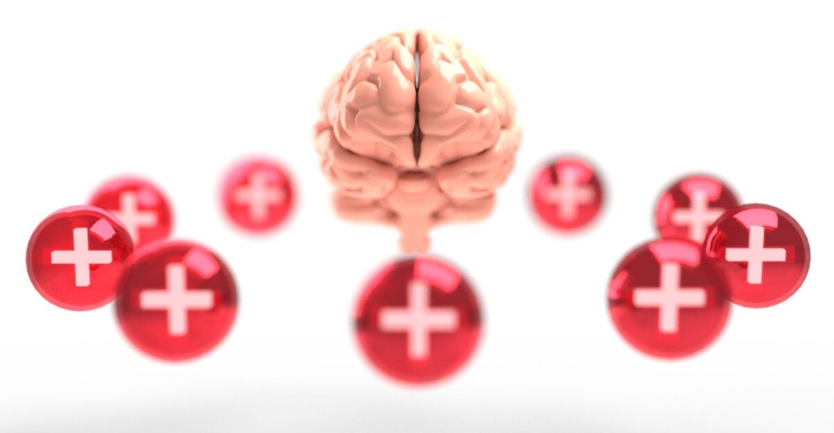Conceptual image of mental health showing a brain surrounding by red orbs