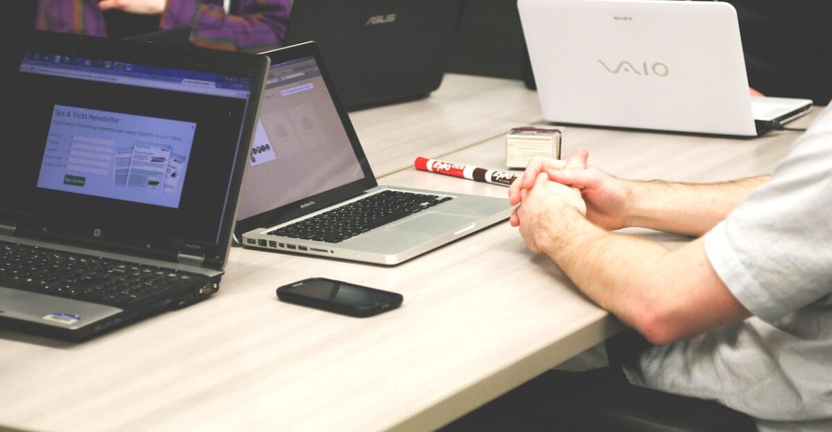 laptops meeting businessmen coworkers colleagues business meeting conference room meeting room startup start-up notebooks creative company silicon valley modern office conference table discussion business team computers desk technology vaio people working meeting meeting meeting meeting meeting business meeting office office discussion discussion business business business team team