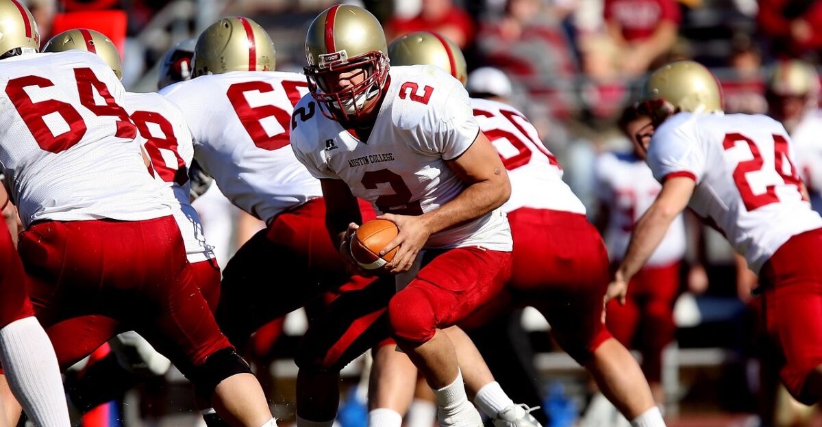 football quarterback team scrimmage game play competition field playing nature action player american football team american football field sport helmet athlete male competitive uniform grass texas