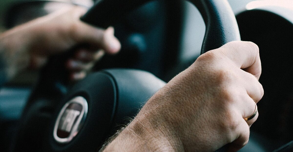 adult automobile automotive blur car close-up dashboard drive driver driving focus hands indoors car wallpapers person safety seat steering wheel transportation system vehicle window