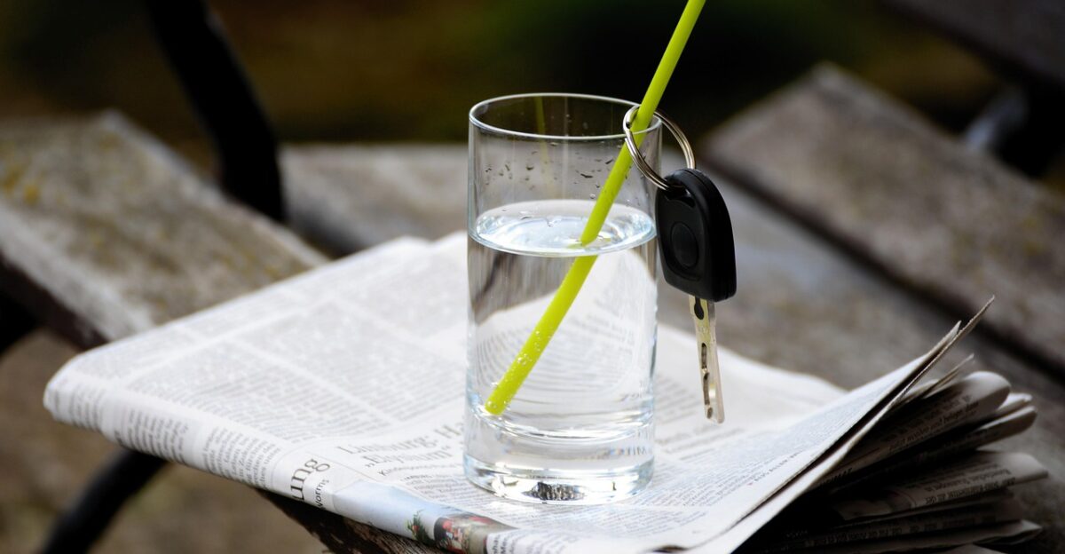 water water glass car key ignition key key no alcohol alcohol free drive nature waiver drink refreshment newspaper bank drinking straw