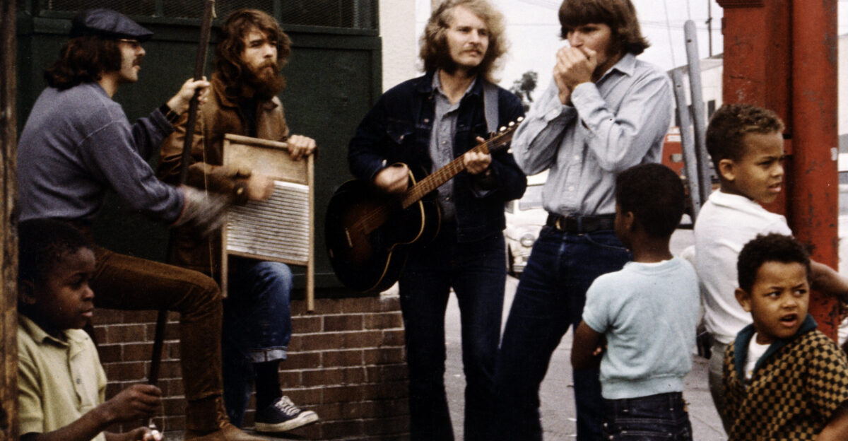 The members of Creedence Clearwater Revival during a street