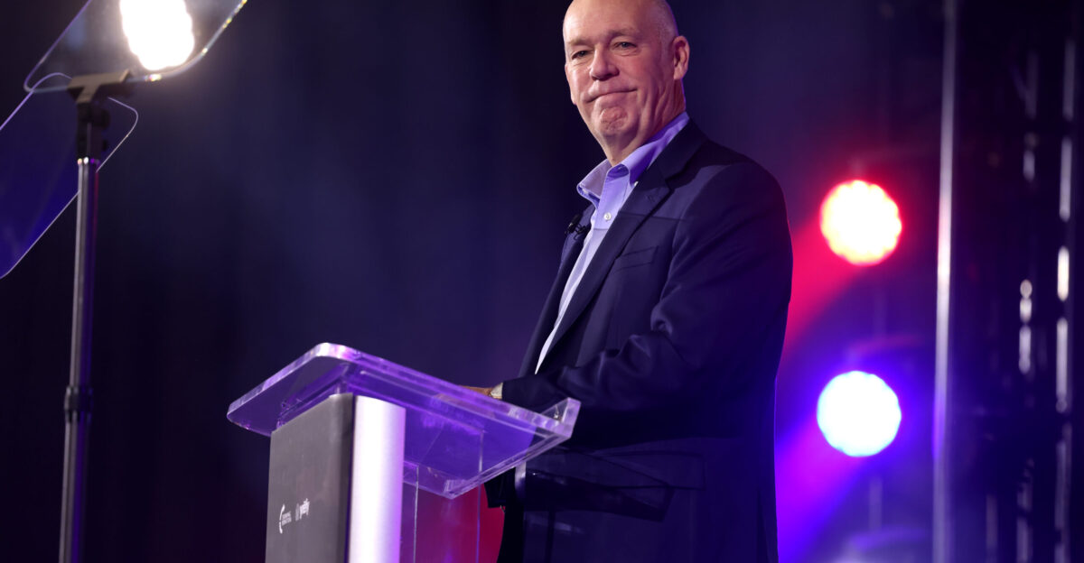 Montana Governor Greg Gianforte speaking with attendees at the Montana State University tour stop of This Is The Turning Point tour at Brick Breeden Fieldhouse in Bozeman Montana