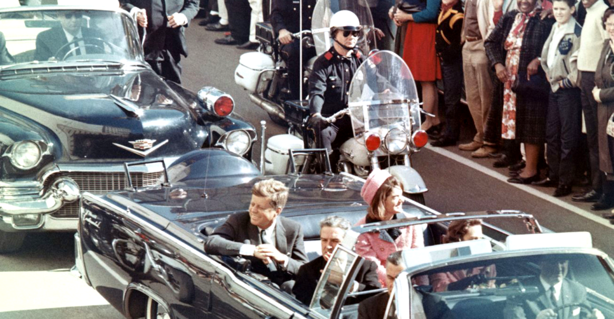Picture of President Kennedy in the limousine in Dallas Texas on Main Street minutes before the assassination Also in the presidential limousine are Jackie Kennedy Texas Governor John Connally and his wife Nellie