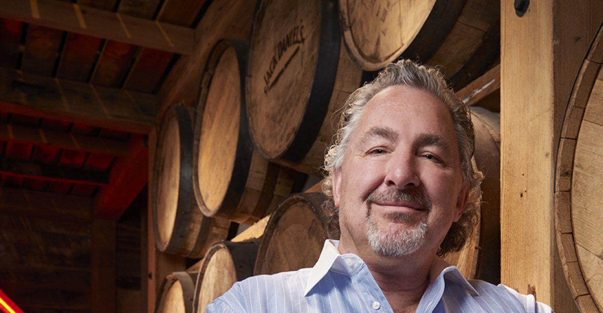 JW ROTH Owner of NOTES LIVE and Bourbon Brothers, standing in his Bourbon Room at Bourbon Brothers Smokehouse and Tavern.