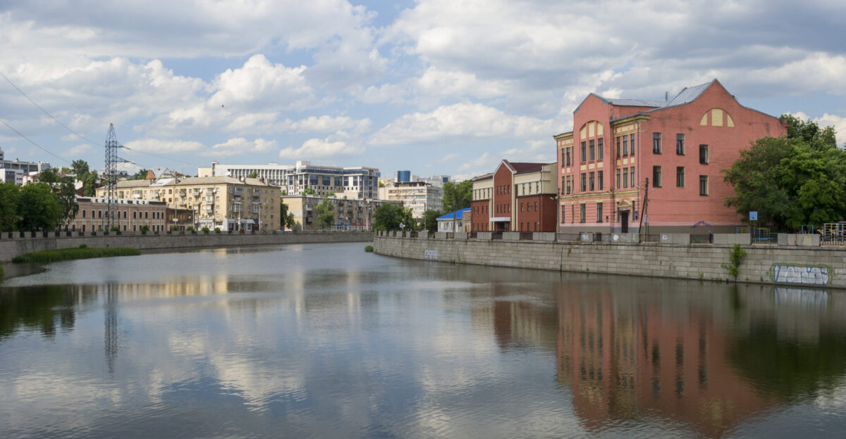 View on Kharkiv River and Kharkivska Embankment from Kharkiv Bridge On the right side the building of the former private gymnasium is situated Kharkivska Embankment 4 inscribed on the list of historical monuments