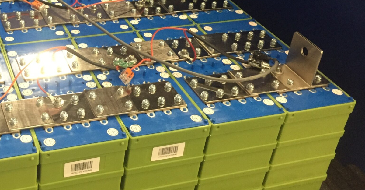 Multiple Lithium Iron Phosphate LiFePO4 Cells at 400 Ah per cell are wired in series and parallel to create an 800Ah 52 Volt battery.  Total battery capacity is 800Ah x 52V = 41.6 kWh