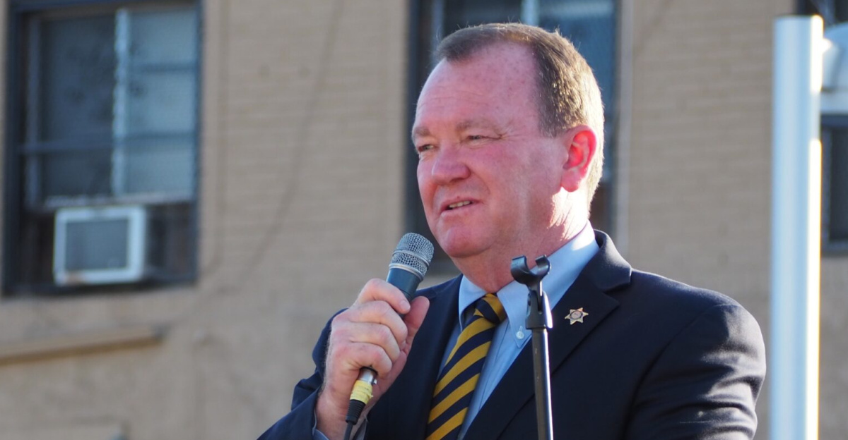 McDonnell joined a lineup of leaders from throughout the county at the rally on July 13, 2018. Residents in attendance left pairs of shoes in the street at the corner of Manchester and Vermont to represent family and friends who were killed by guns.