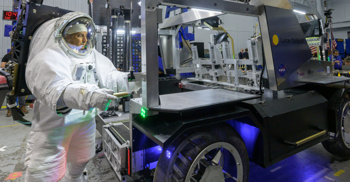 NASA astronaut Joe Acaba raises the solar array panel on Lunar Outpost’s Eagle lunar terrain vehicle during testing at NASA’s Johnson Space Center. Image Credit: NASA/Robert Markowitz