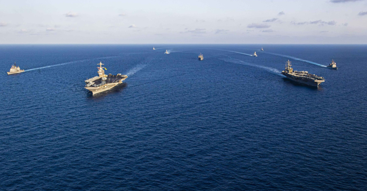 Ships from the Gerald R. Ford and Dwight D. Eisenhower Carrier Strike Groups (CSG), U.S. Sixth Fleet command ship USS Mount Whitney (LCC 20), and Italian Navy frigates Carlo Margottini (F 592) and Virginio Fasan (F 591) sail in formation in the Mediterranean Sea, Nov. 3, 2023. The two carrier strike groups are operating in the area at the direction of the Secretary of Defense to bolster deterrence in the region.The ships from the Gerald R. Ford Carrier Strike Group include the first-in-class aircraft carrier USS Gerald R. Ford (CVN 78), the Ticonderoga-class guided-missile cruiser USS Normandy (CG 60), and the Arleigh Burke-class guided-missile destroyer USS Ramage (DDG 61) and USS Paul Ignatius (DDG 117).The ships from the Dwight D. Eisenhower Carrier Strike Group include the Nimitz-class aircraft carrier USS Dwight D. Eisenhower (CVN 69), the Ticonderoga-class guided-missile cruiser USS Philippine Sea (CG 58), and the Arleigh Burke-class guided-missile destroyers USS Gravely (DDG 107) and the USS Mason (DDG 87).