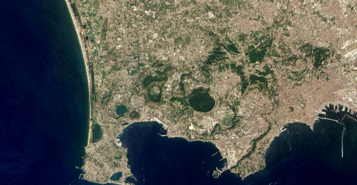 The Campi Flegrei caldera cluster is the largest volcanic feature along the Bay of Naples which is also home to the more famous Vesuvius The Campi Flegrei or Fiery Fields is built from a series of overlapping volcanic features-calderas domes and cinder cones-that are historically active The Campi Flegrei calderas have produced two of the largest eruptions Europe has seen in the past 40 000 years The Neopolitan Yellow Tuff rock composed of fragments of material embedded within volcanic ash was erupted roughly 12 800 years ago with a total volume of at least 40 cubic kilometers 10 cubic miles The Campanian Ignimbrite rock made from the fused remnants of a pyroclastic flow is about 32 800 years old and has a volume of at least 100 cubic kilometers 20 cubic miles Since the Neopolitan Yellow Tuff was formed numerous small eruptions have occurred in the caldera complex mostly less than half a cubic kilometer 0 1 cubic miles in size The most recent eruption occurred in 1538 at Monte Nuovo a small cinder cone that strombolian activity killed at least 32 people The most obvious manifestation of the magma under the surface at the Campi Flegrei is the La Solfatara a region of intense hydrothermal activity There has also been repeated cycles of uplift and subsidence near the city of Pozzouli sometimes on the order of meters per decade along with degassing within the Gulf of Pozzouli This natural-color image was acquired by the Advanced Land Imager ALI aboard the Earth Observing-1 EO-1 satellite on July 9 2012