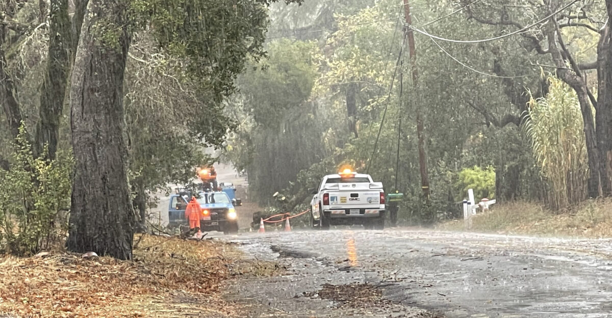 PG E trucks working on downed power lines during the October 2021 California rainstorm in Glen Ellen California
