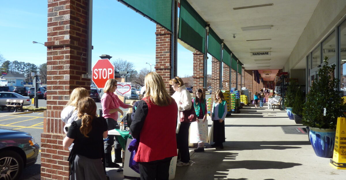 Some girl scouts are selling cookies in front of Blackhawk Hardware at Park Road Shopping Center on February 13 2011