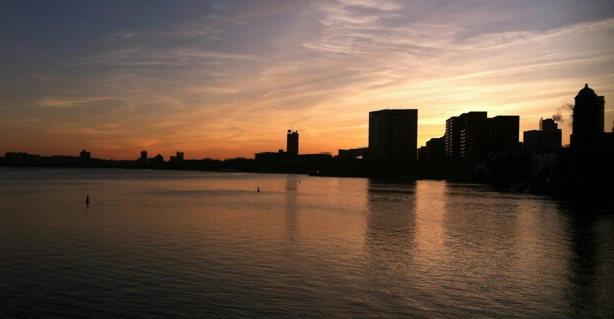 Captivating view of Boston s skyline in silhouette against a colorful twilight sky