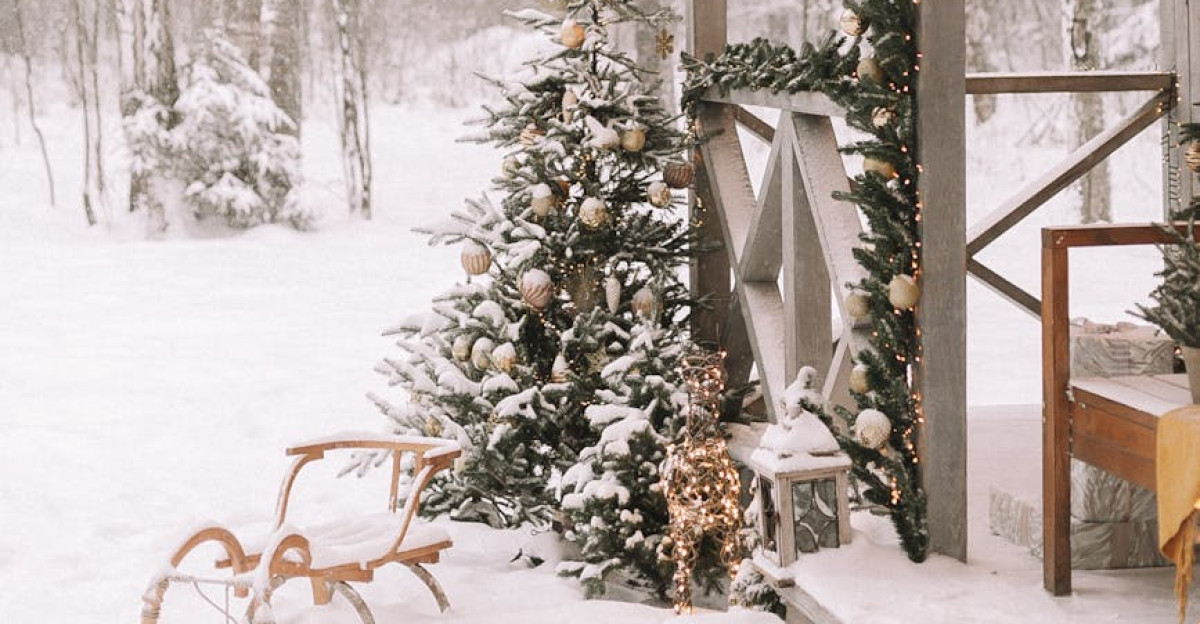 Charming snow-covered cabin decorated for Christmas in a snowy forest