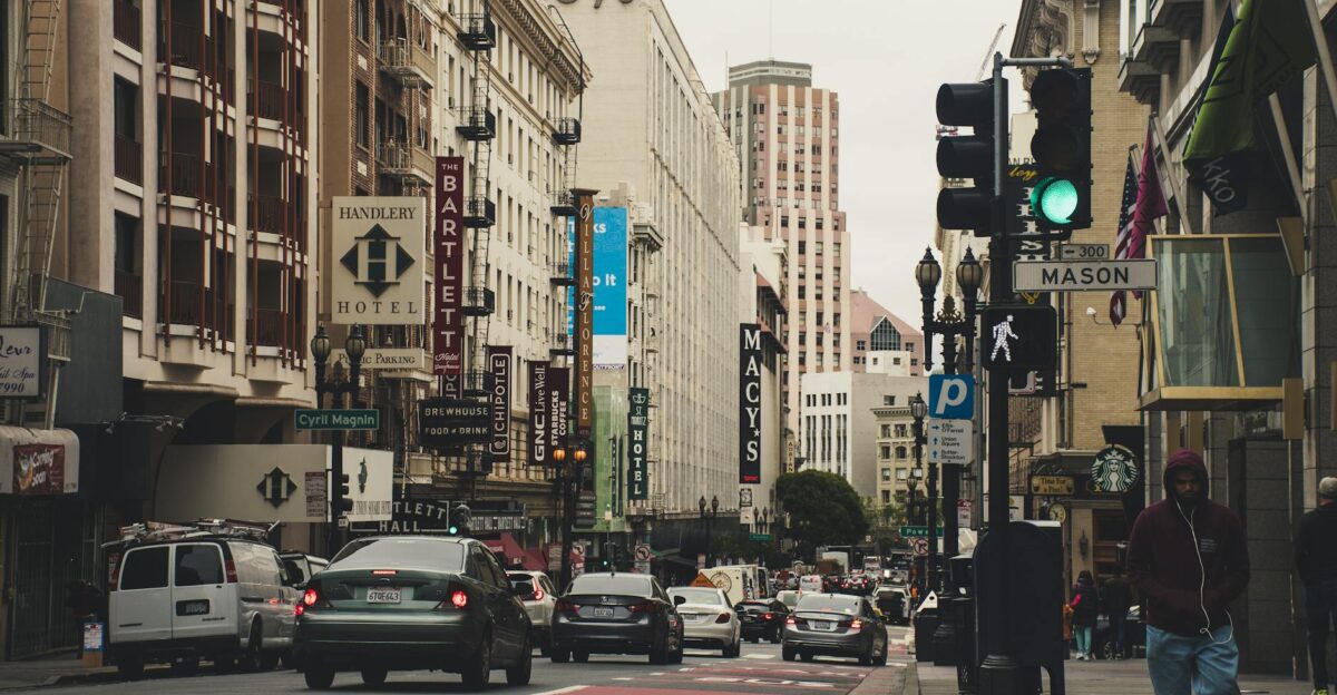 Urban cityscape of San Francisco featuring iconic buildings traffic and people