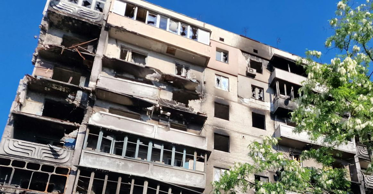 A damaged residential building in Irpin Ukraine showcasing its war-torn condition