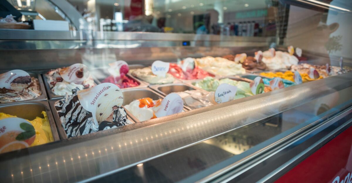 Delicious assortment of colorful gelato flavors beautifully presented in an ice cream shop display