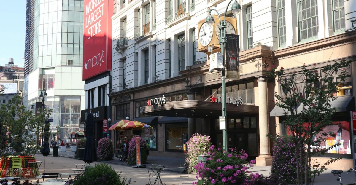 Daytime view of Macy s storefront in New York City showcasing urban architecture and bustling streets