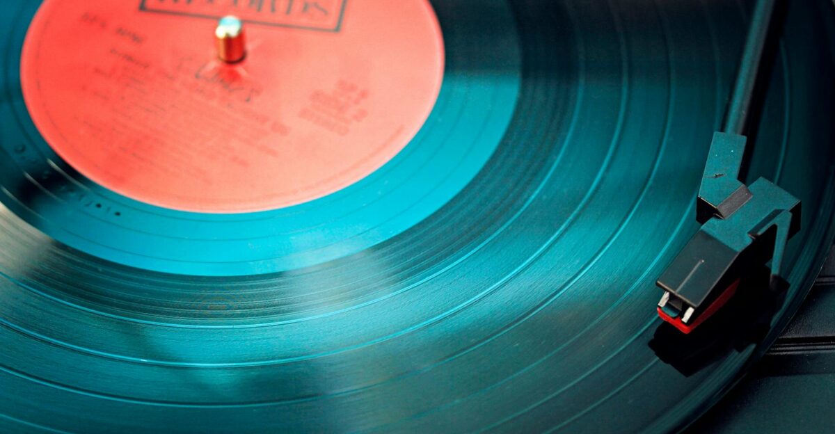 A detailed close-up view of a vintage vinyl record spinning on a turntable capturing its nostalgic beauty