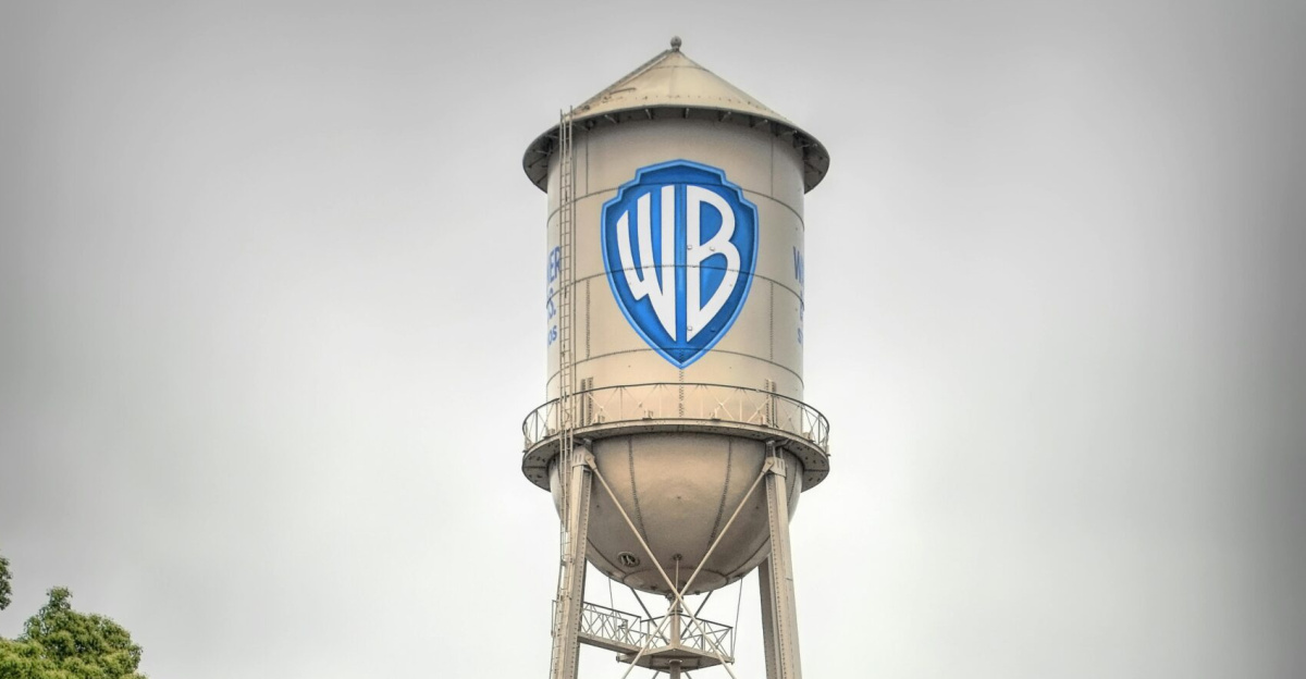 Iconic Warner Bros Studio water tower in Burbank, showcasing urban architecture against a mountain backdrop.