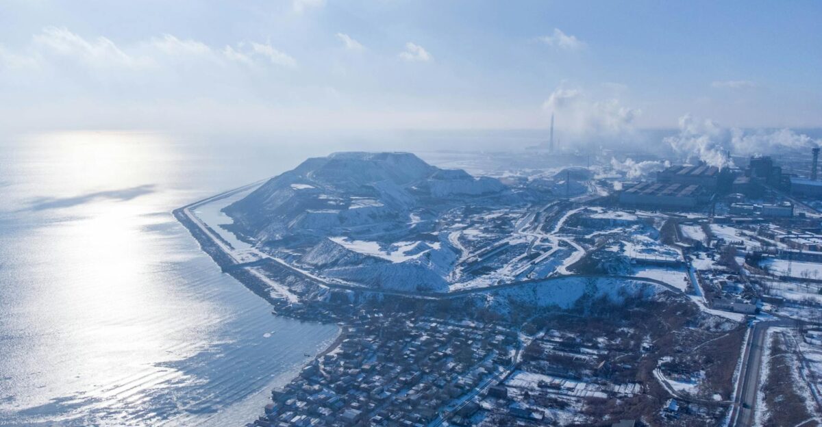 Aerial view of Mariupol Ukraine in winter showcasing coastline residential districts and steel mills