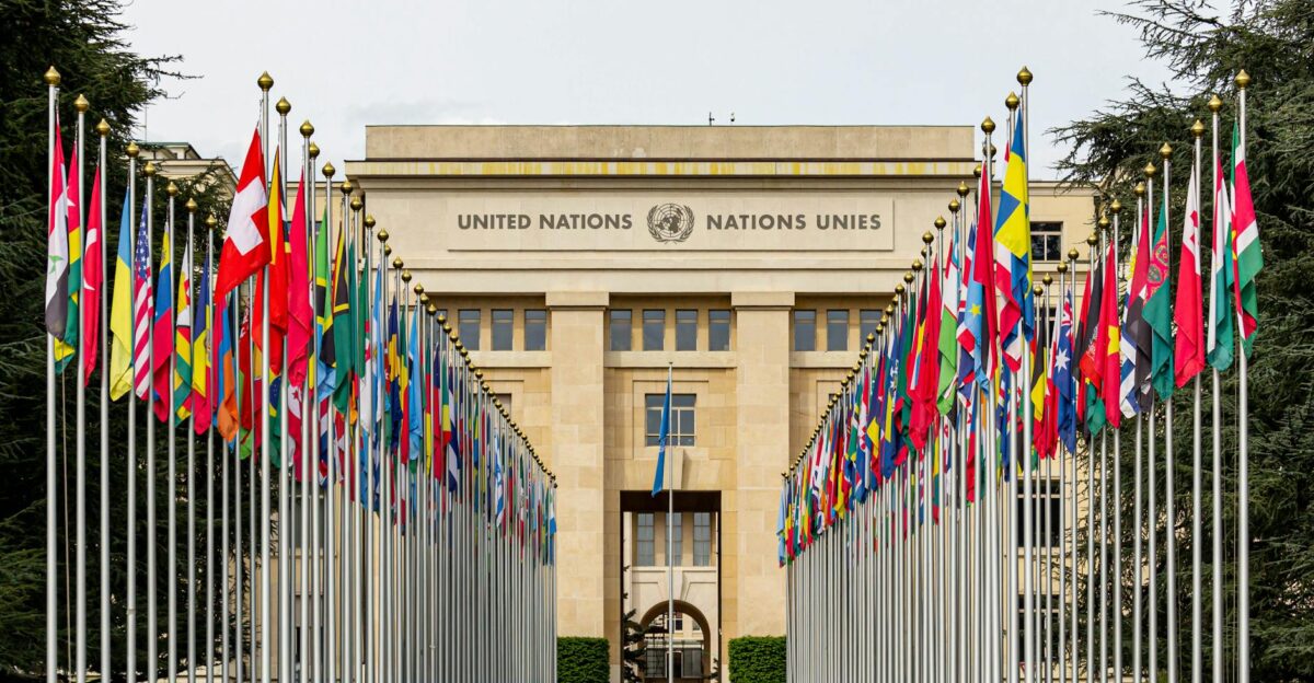 View of the United Nations Office in Geneva adorned with flags of various countries