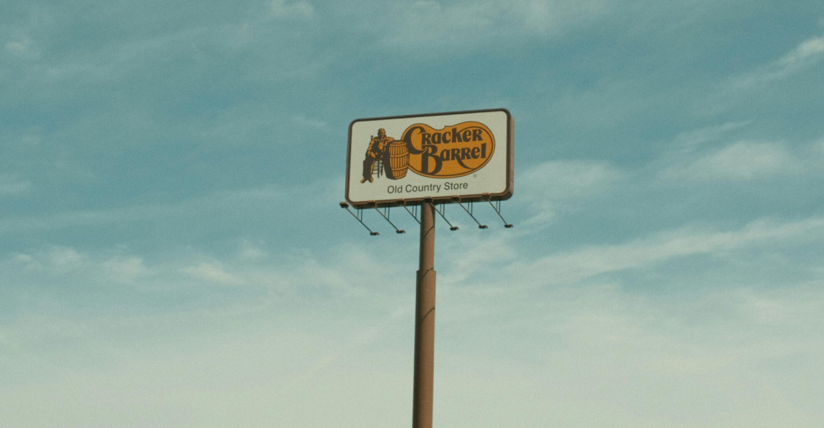 Cracker Barrel signpost with a clear blue sky background in Valdosta, GA, USA.