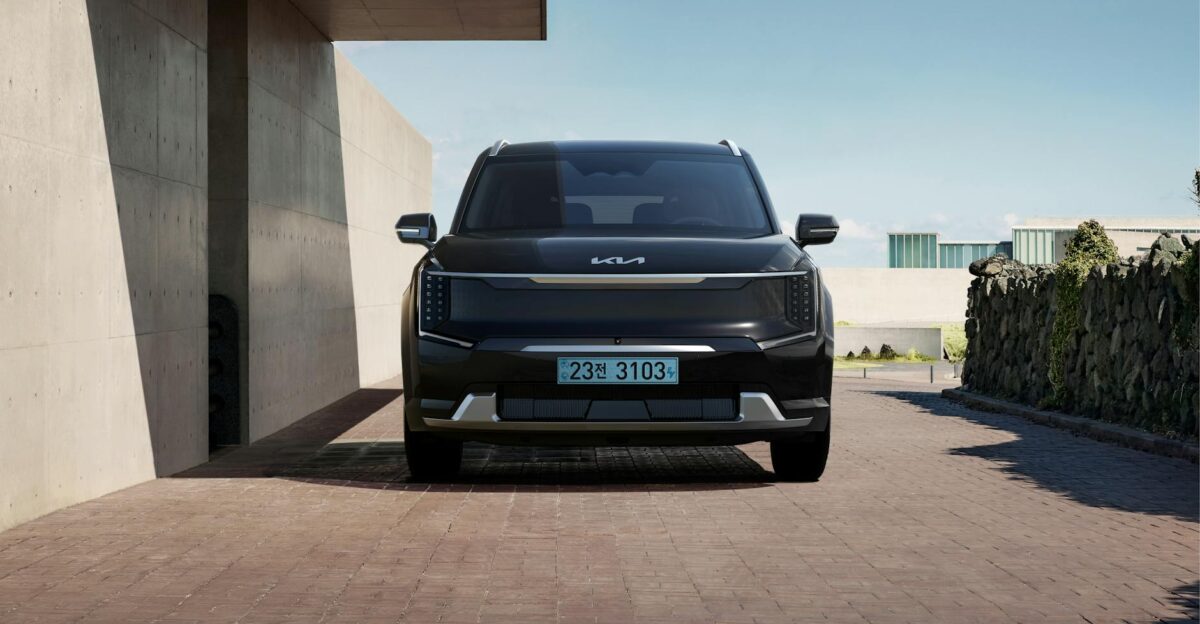 Sleek black electric SUV parked in a contemporary architectural environment