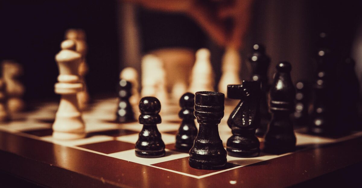 Close-up of a chessboard showcasing strategy tactics and focus in a competitive game
