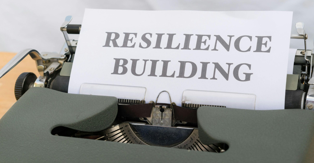 A vintage typewriter with a paper showing "Resilience Building," symbolizing personal growth and resilience.