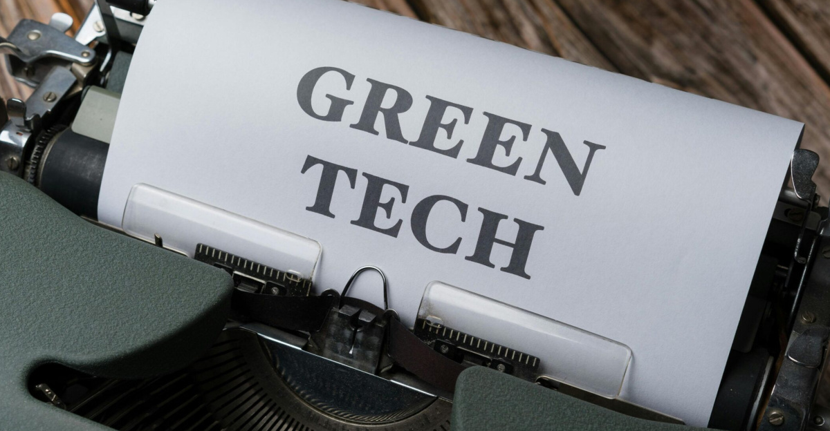 A top view of a vintage typewriter with 'Green Tech' typed on paper, symbolizing sustainable technology.