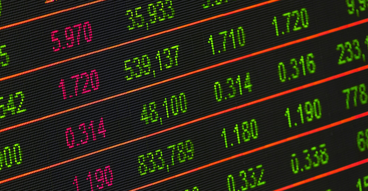 Close-up of a digital stock market data display showing colorful financial numbers and trends.