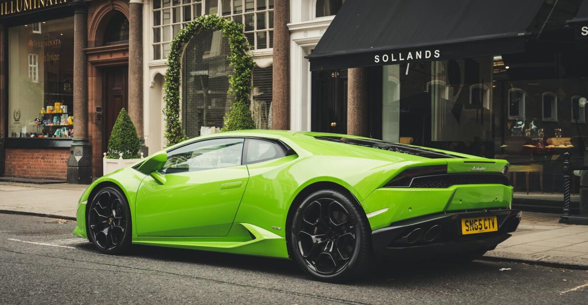 A vibrant lime green Lamborghini parked on a London street showcasing luxury and style